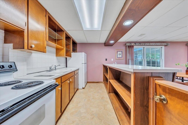 5241 N Spring Dr, Roanoke, VA 24019 - kitchen with open shelves, white appliances, a sink, brown cabinetry, and recessed lighting