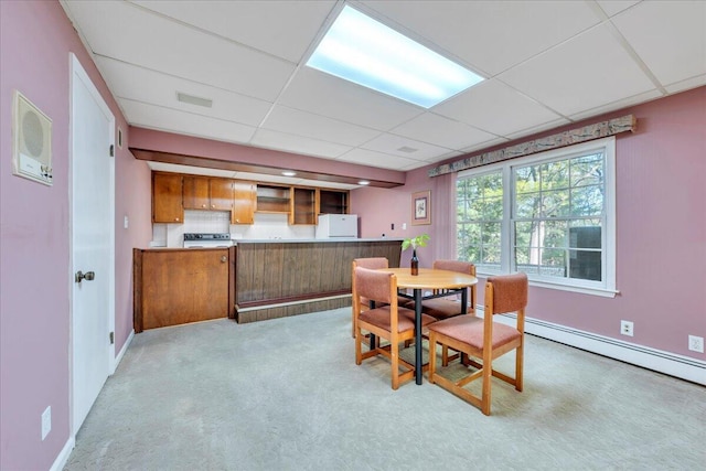 5241 N Spring Dr, Roanoke, VA 24019 - dining space featuring a paneled ceiling, light carpet, baseboard heating, and baseboards