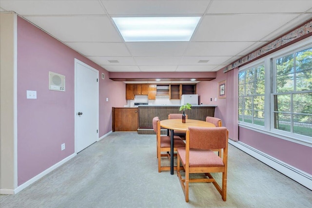 5241 N Spring Dr, Roanoke, VA 24019 - dining area with a baseboard heating unit, a drop ceiling, baseboards, and light colored carpet