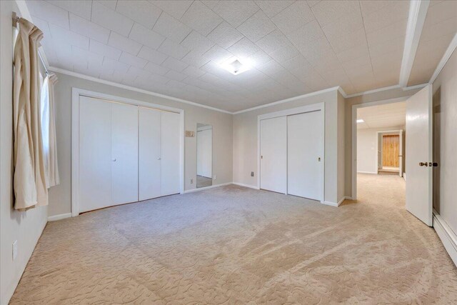 5241 N Spring Dr, Roanoke, VA 24019 - unfurnished bedroom featuring ornamental molding, two closets, carpet, and baseboards