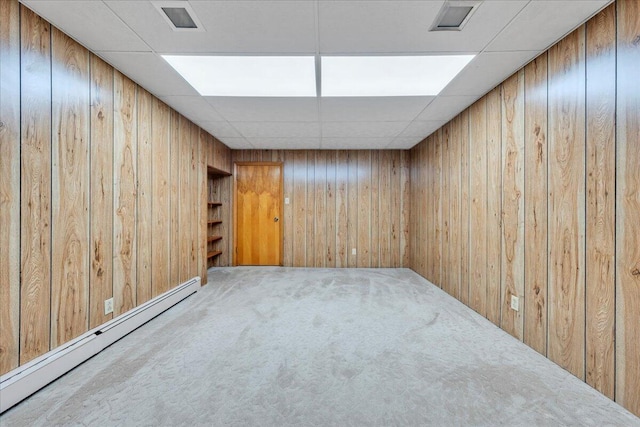 5241 N Spring Dr, Roanoke, VA 24019 - finished basement featuring a baseboard heating unit, carpet, and wooden walls