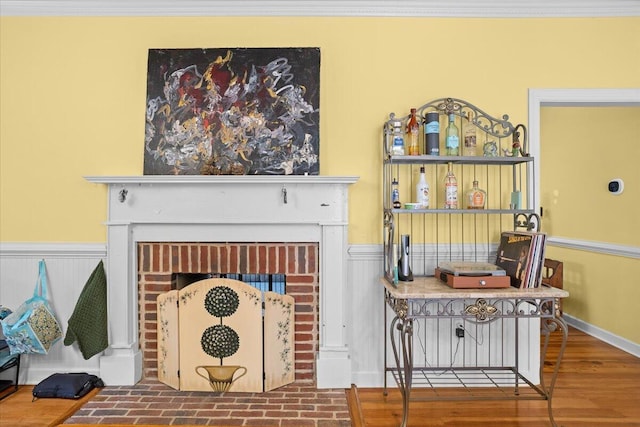 detailed view of a fireplace and wood finished floors