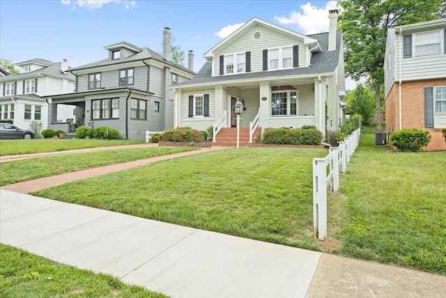 view of front of house with cooling unit, a chimney, and covered porch