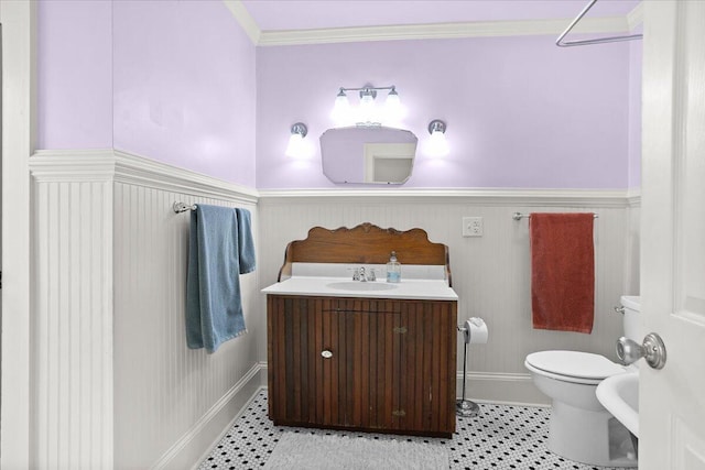 2509 Rosalind Ave SW, Roanoke, VA 24014 - bathroom featuring a wainscoted wall, toilet, vanity, baseboards, and ornamental molding