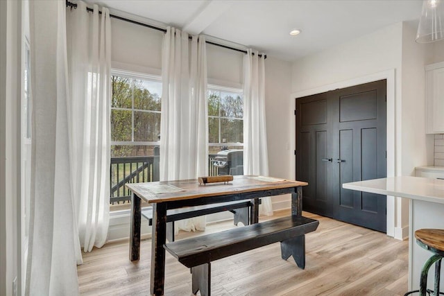 dining space featuring light wood-type flooring and recessed lighting