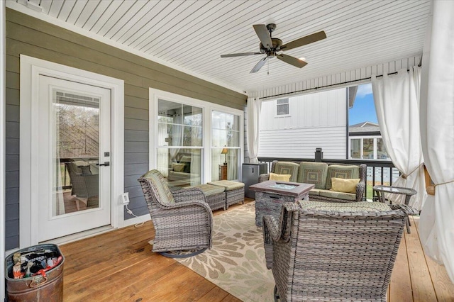 exterior space featuring an outdoor fire pit and ceiling fan