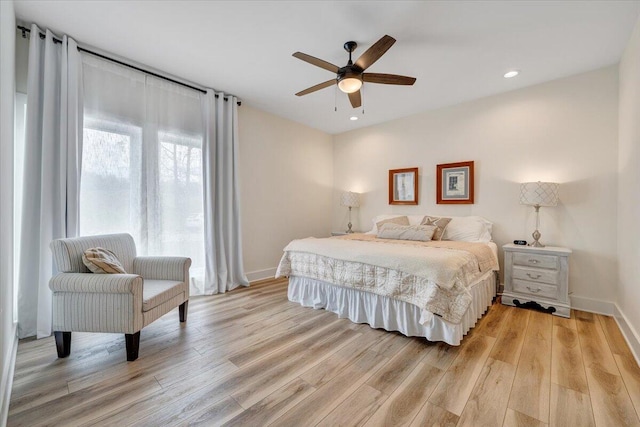 bedroom with baseboards, light wood finished floors, ceiling fan, and recessed lighting