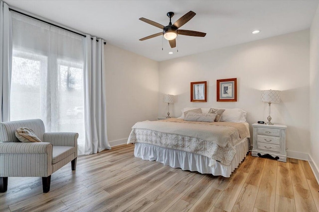 bedroom with baseboards, light wood finished floors, recessed lighting, and a ceiling fan