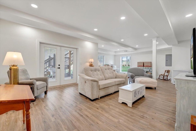 living room featuring light wood-style flooring, french doors, and recessed lighting