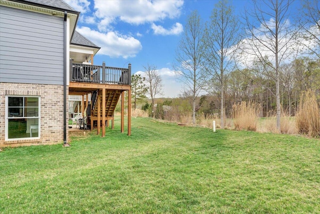 view of yard with stairs and a wooden deck