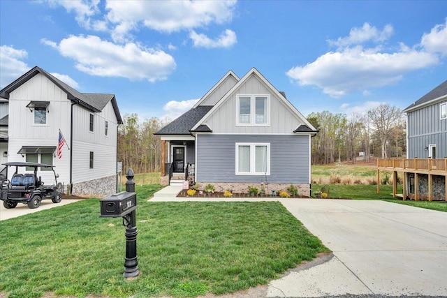 craftsman inspired home with board and batten siding and a front lawn