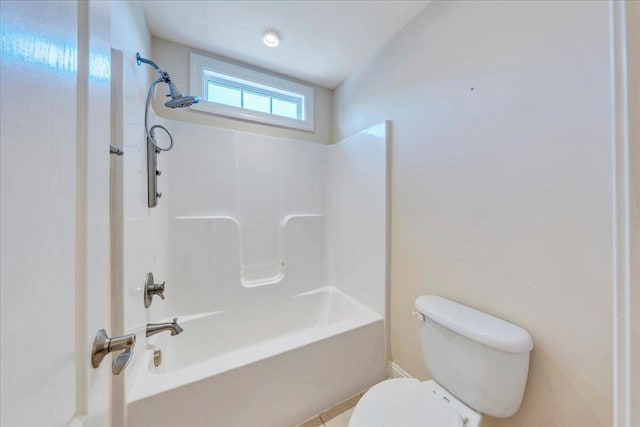 bathroom with shower / bath combination, tile patterned flooring, and toilet