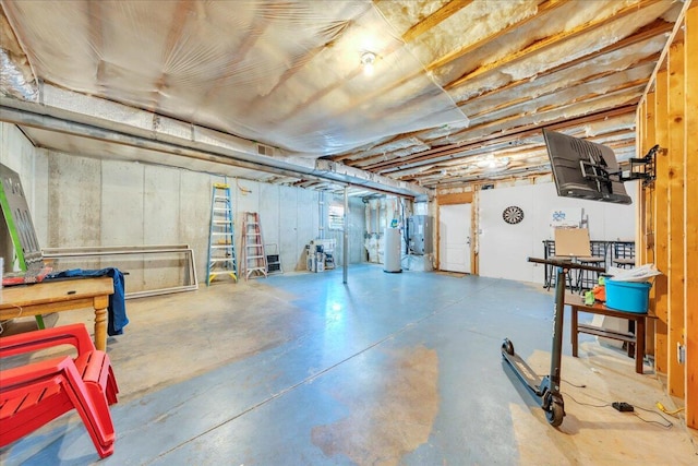 unfinished below grade area featuring water heater