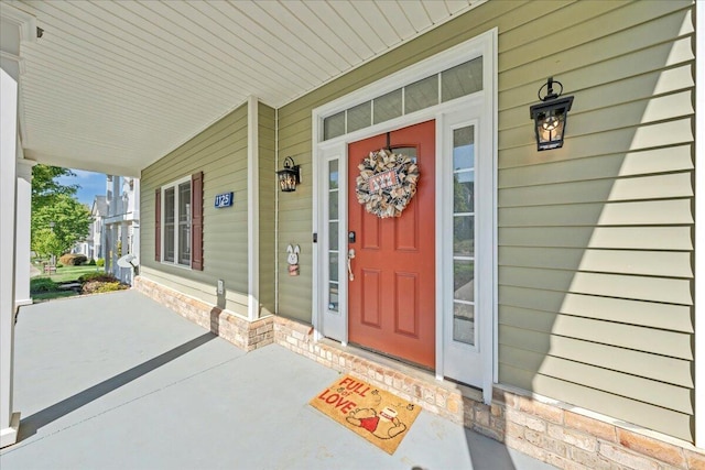 property entrance with covered porch