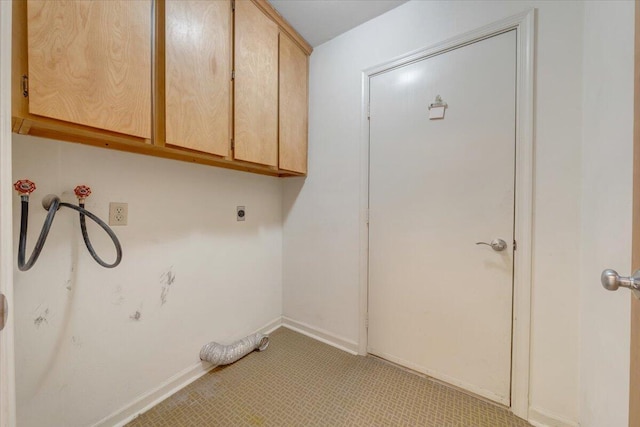 laundry area with baseboards, hookup for an electric dryer, washer hookup, and cabinet space