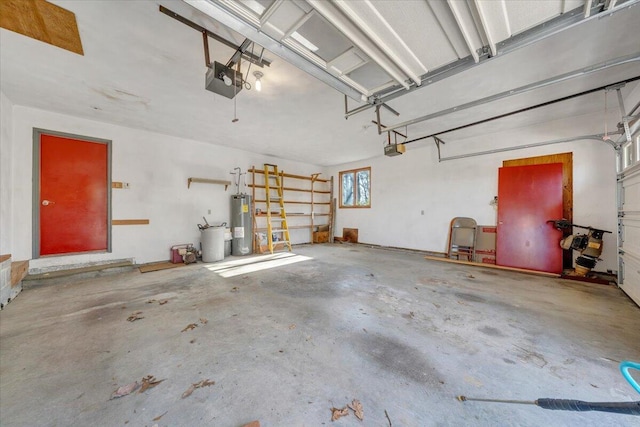 garage featuring a garage door opener and electric water heater