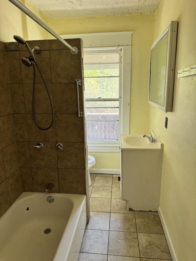 full bath with baseboards, shower / washtub combination, toilet, vanity, and tile patterned floors