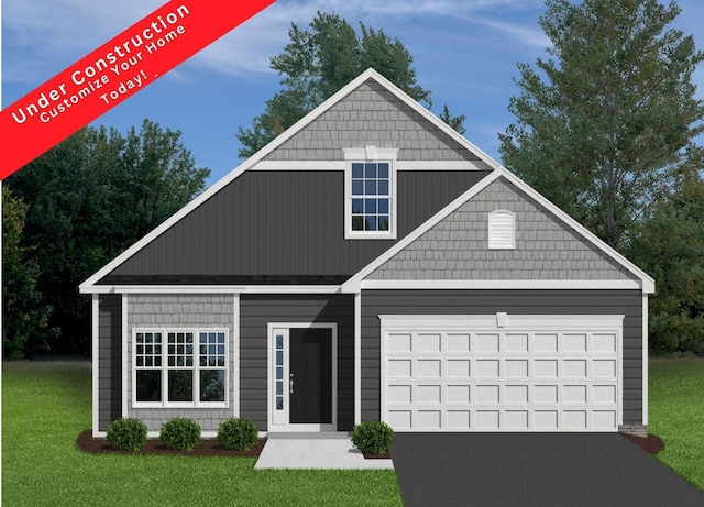 view of front of home with a garage, a front lawn, and driveway