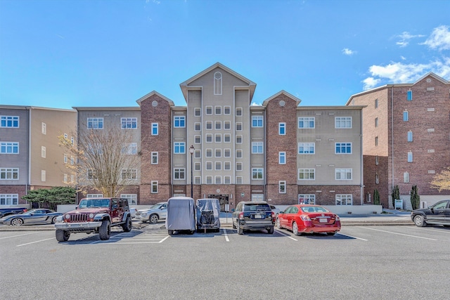 1245 Graves Harbor Trl Unit 206, Huddleston, VA 24104 - view of building exterior with uncovered parking