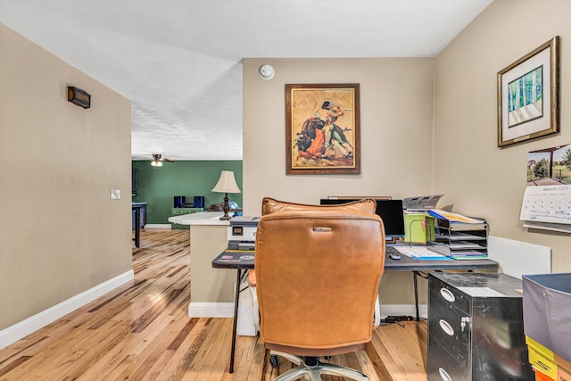 office space with ceiling fan, wood finished floors, and baseboards