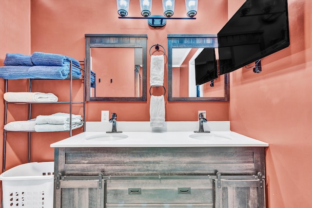 full bath featuring a sink and double vanity