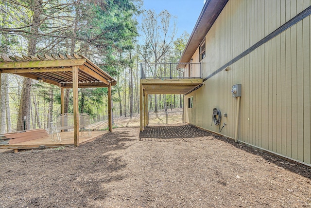 exterior space with a pergola and a wooden deck