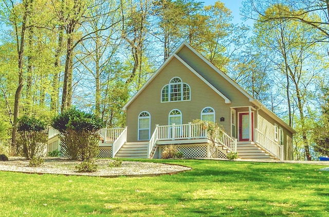 view of front of home with a front lawn and a deck