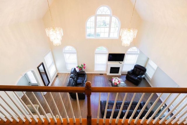 living room with a high ceiling and a notable chandelier