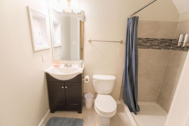 full bath with vanity, toilet, and a stall shower
