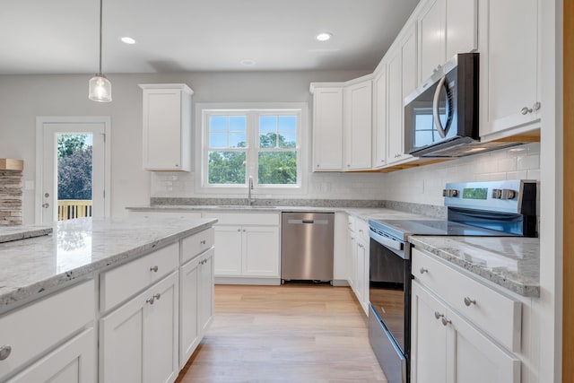 45 Island Green Rd, Daleville, VA 24083 - kitchen featuring appliances with stainless steel finishes, plenty of natural light, light wood-type flooring, backsplash, and recessed lighting