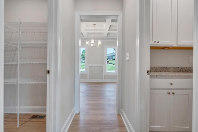 45 Island Green Rd, Daleville, VA 24083 - hallway with coffered ceiling, light wood finished floors, a chandelier, and beam ceiling