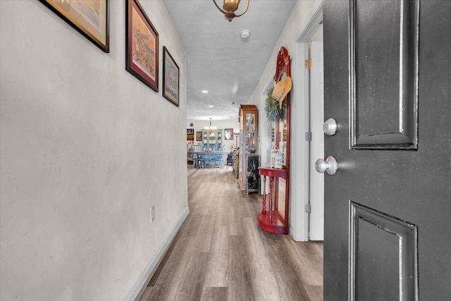 38 Point Pleasant Ave, Salem, VA 24153 - hall featuring an inviting chandelier, wood finished floors, and baseboards