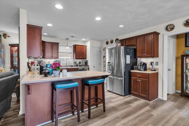 38 Point Pleasant Ave, Salem, VA 24153 - kitchen featuring a peninsula, light wood-type flooring, stainless steel fridge, and light countertops