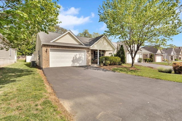 38 Point Pleasant Ave, Salem, VA 24153 - ranch-style home featuring brick siding, a garage, driveway, central AC, and a front yard