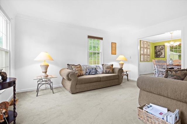 living area with a chandelier, crown molding, carpet floors, and baseboards