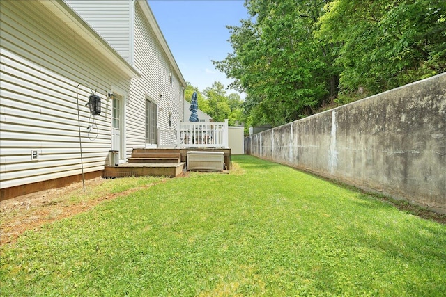 view of yard with a wooden deck