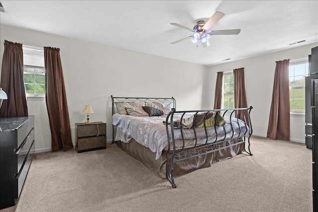 bedroom featuring carpet, baseboards, and a ceiling fan