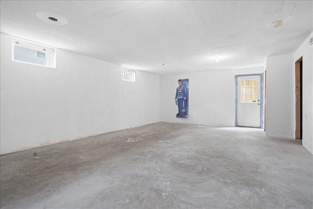 below grade area featuring a textured ceiling