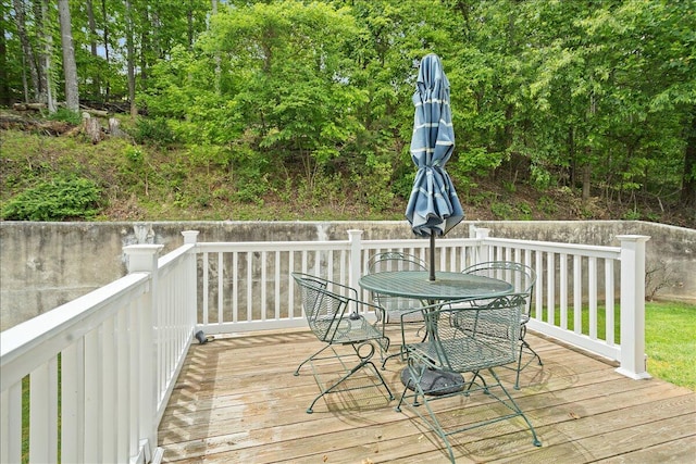 wooden deck with outdoor dining area