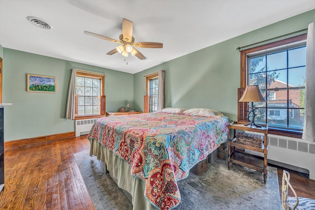1112 Highland Rd, Salem, VA 24153 - bedroom with radiator, hardwood / wood-style floors, and baseboards
