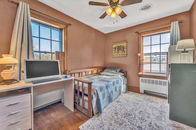 1112 Highland Rd, Salem, VA 24153 - bedroom featuring radiator heating unit, dark wood finished floors, and an office area