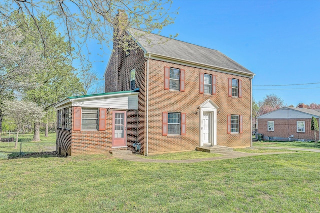1112 Highland Rd, Salem, VA 24153 - view of front facade with a chimney and brick siding