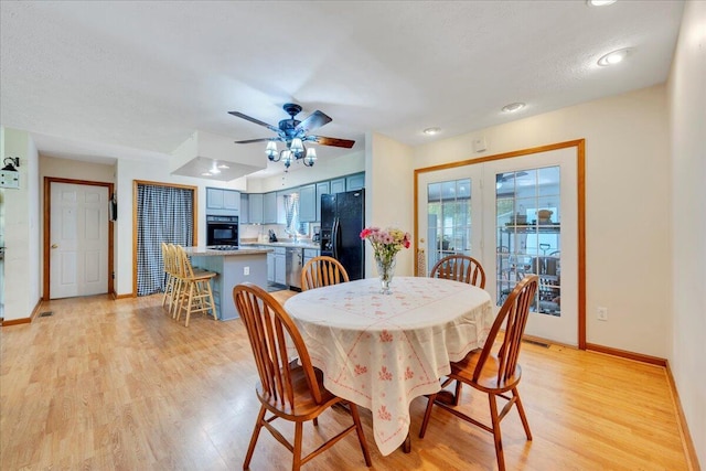 dining space featuring a ceiling fan, baseboards, light wood-style flooring, and recessed lighting