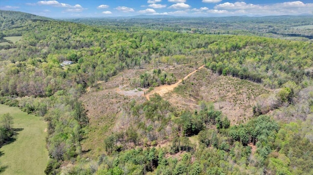 drone / aerial view featuring a view of trees