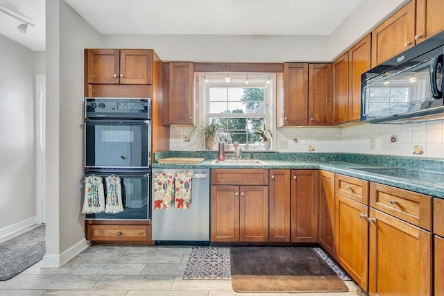 2626 Avenham Ave SW, Roanoke, VA 24014 - kitchen with black appliances, brown cabinets, a sink, tasteful backsplash, and baseboards