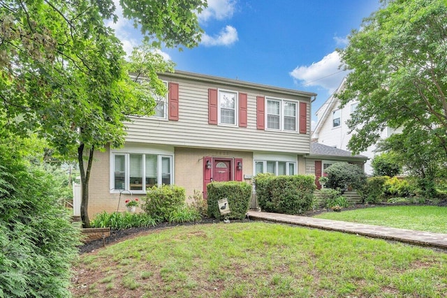 2626 Avenham Ave SW, Roanoke, VA 24014 - colonial home featuring a front lawn and brick siding