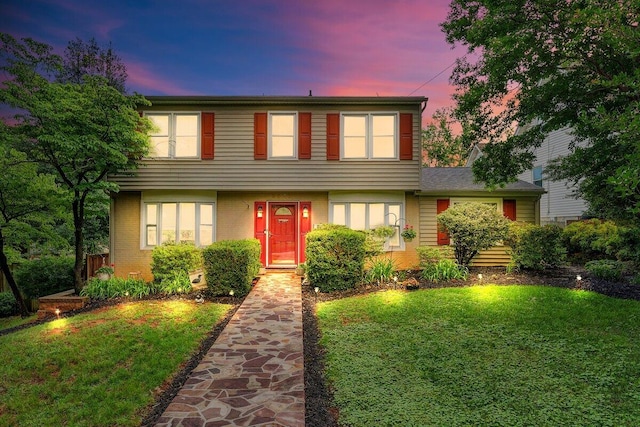 2626 Avenham Ave SW, Roanoke, VA 24014 - colonial house featuring a lawn and brick siding