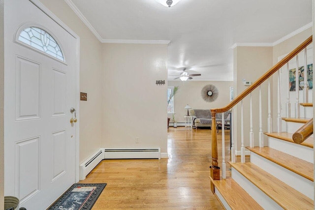 2626 Avenham Ave SW, Roanoke, VA 24014 - foyer featuring light wood-style floors, ornamental molding, stairs, ceiling fan, and a baseboard heating unit