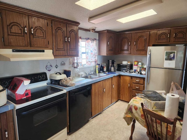 402 Mountain Meadow Dr, Vinton, VA 24179 - kitchen featuring a sink, dishwasher, range with electric cooktop, under cabinet range hood, and freestanding refrigerator