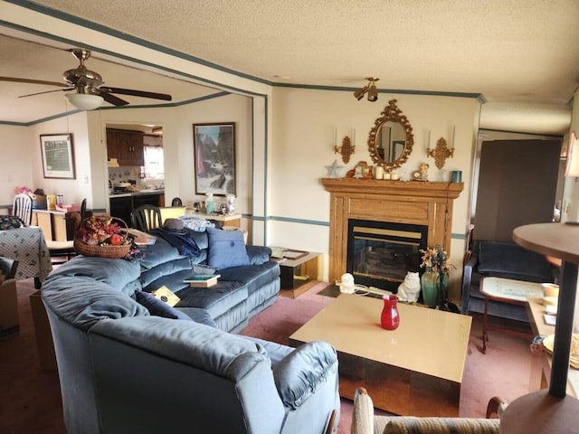 402 Mountain Meadow Dr, Vinton, VA 24179 - carpeted living room with a glass covered fireplace, a textured ceiling, crown molding, and ceiling fan